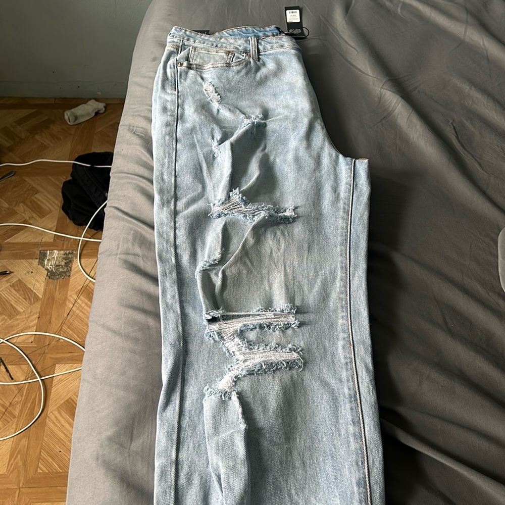 Light blue distressed jeans